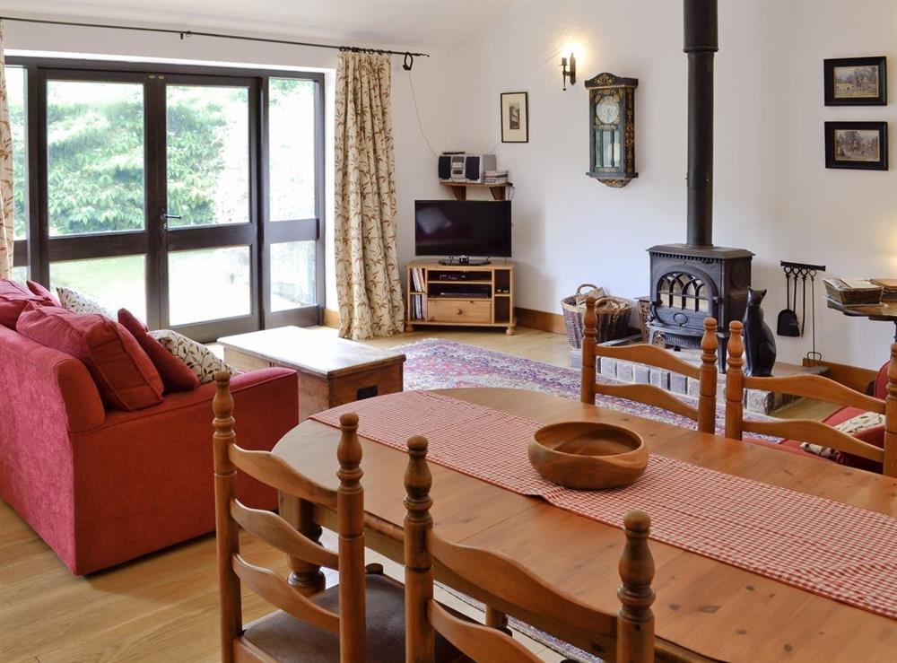 Open plan living/dining room/kitchen at Woodpecker Cottage, 