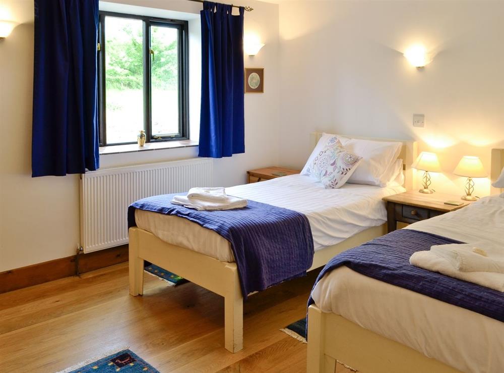 Twin bedroom at Woodpecker Cottage, 