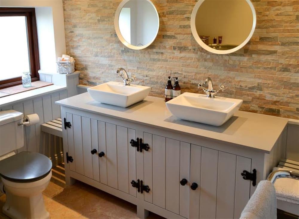 Bathroom with free-standing, claw foot bath at Grange Farmhouse in Hainford, near Aylsham, Norfolk