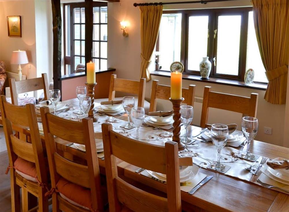 Dining room with beams and wooden floor (photo 2) at Grange Farmhouse in Hainford, near Aylsham, Norfolk
