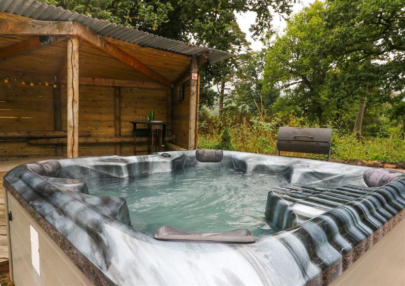Enjoy the hot tub at Grant Cottage, Anaheilt near Strontian