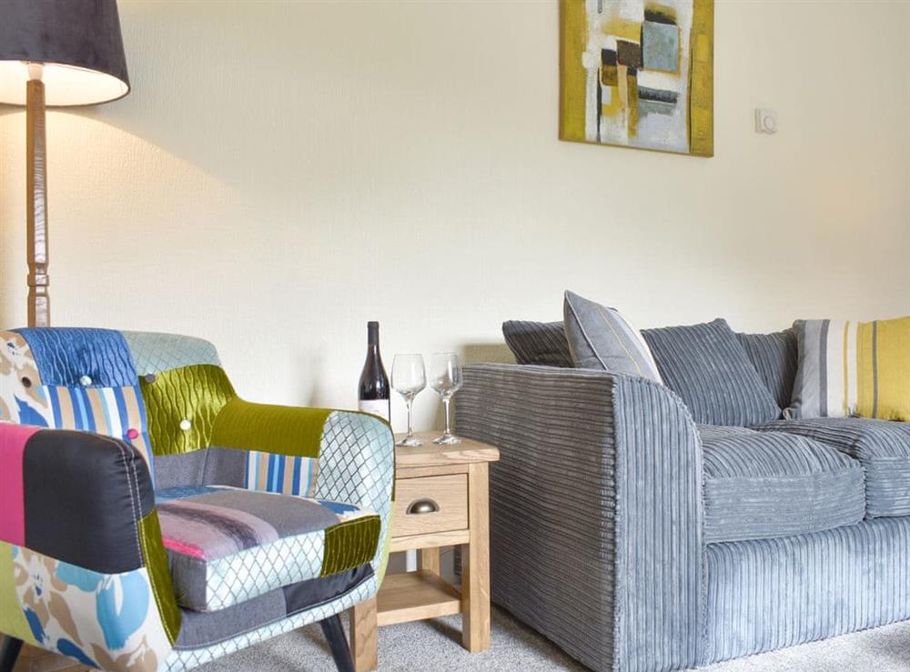 Comfortable seating within living area at Grassgarth Cottage in Redmire, near Leyburn, North Yorkshire