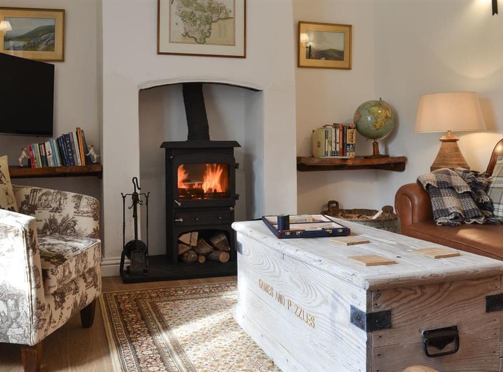 Living room with wood burner (photo 2) at Grattan Cottage, 