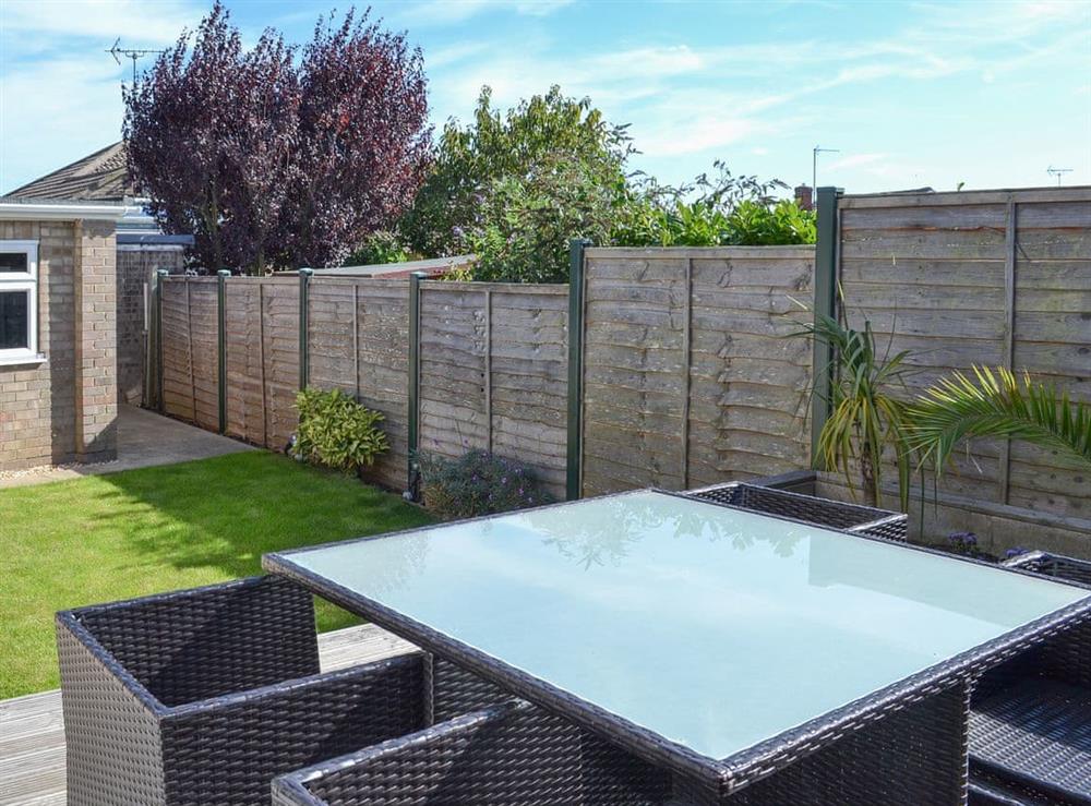 Lovely and sunny outdoor eating area overlooking the garden at Grays Cottage in Bridlington, Yorkshire, North Humberside