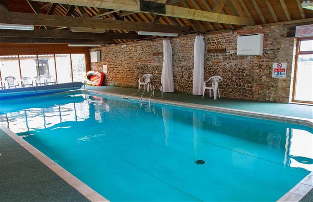 Heated swimming pool for guest use at Great Barn, Toftrees near Fakenham