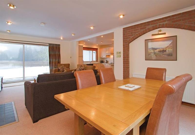 The dining area and living room at Oich View Cottage at Great Glen Cottages in Kinlochlochy, Inverness-shire