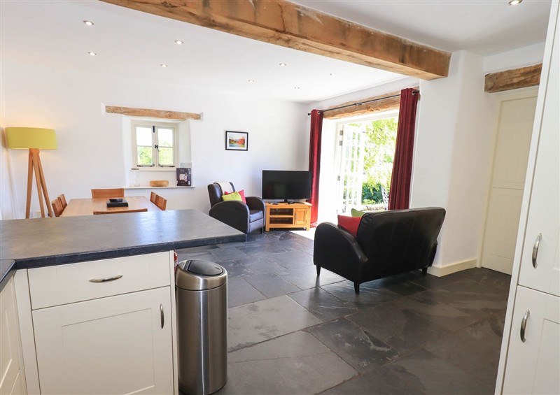 Relax in the living area (photo 2) at Great Hartbarrow Farm Cottage, Cartmel Fell near Windermere