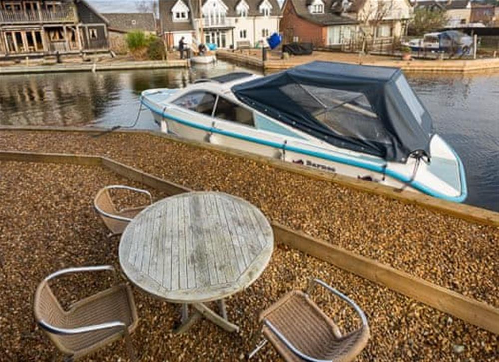 Seating area by the water at Grebe in Wroxham, Norfolk., Great Britain