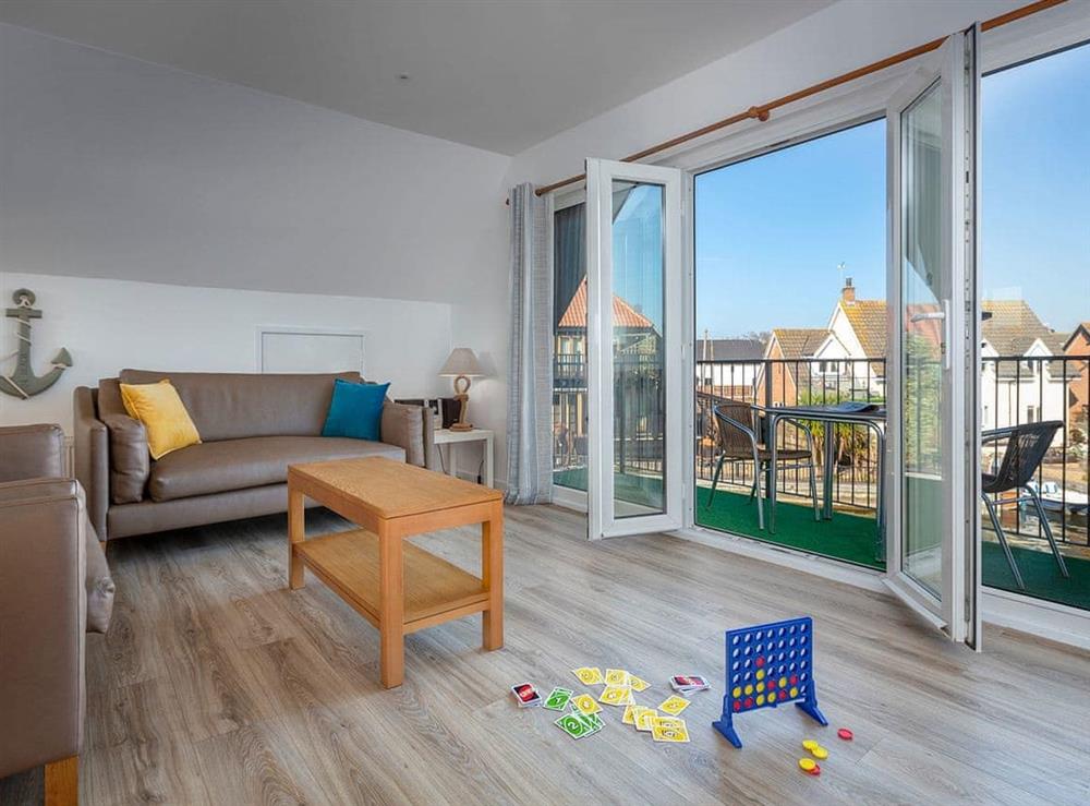 Spacious living area with French doors to balcony at Grebe in Wroxham, Norfolk., Great Britain