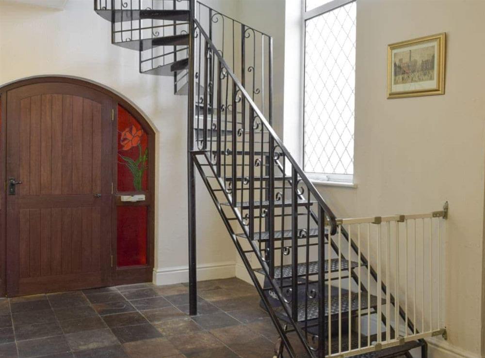 Ornate wrought iron stairs with safety gate at Green Acre Cottage in Kilgetty, Dyfed , Great Britain