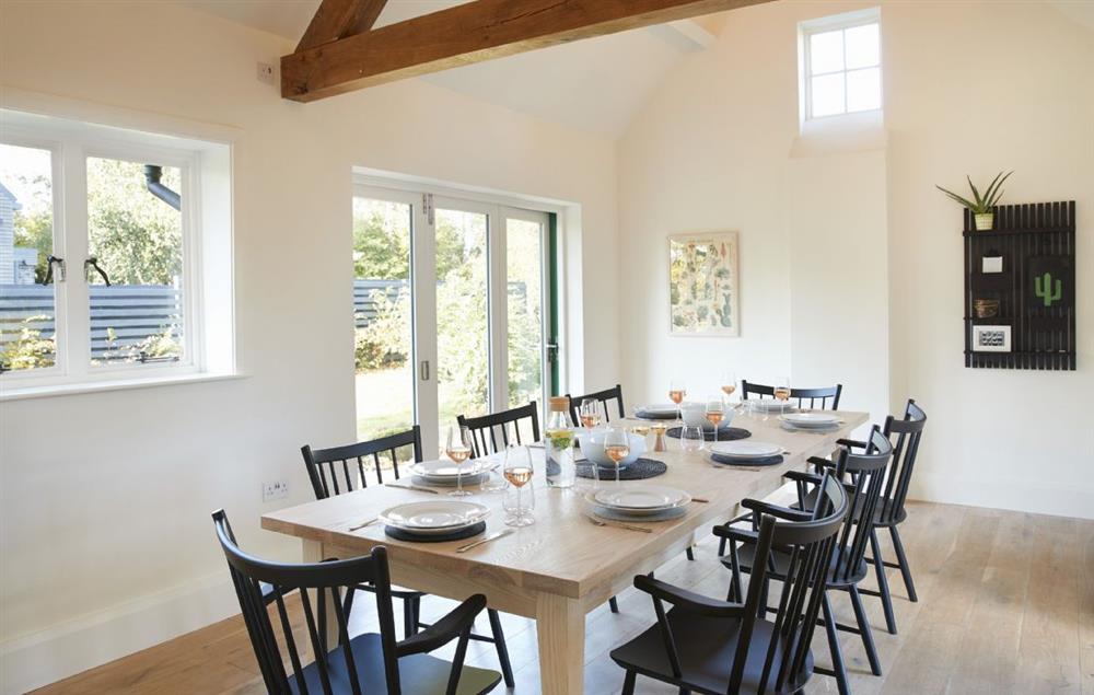 Dining room for up to twelve guests, with bi fold doors opening out onto the garden at Green Gables, Eardisley
