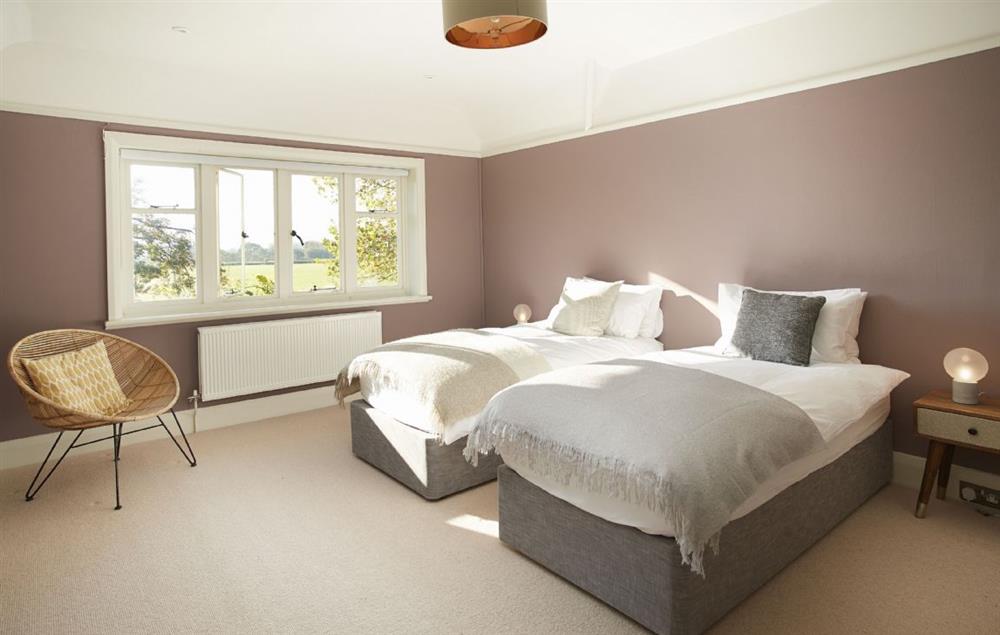 Large bedroom with 6’ king size zip and link double bed at Green Gables, Eardisley