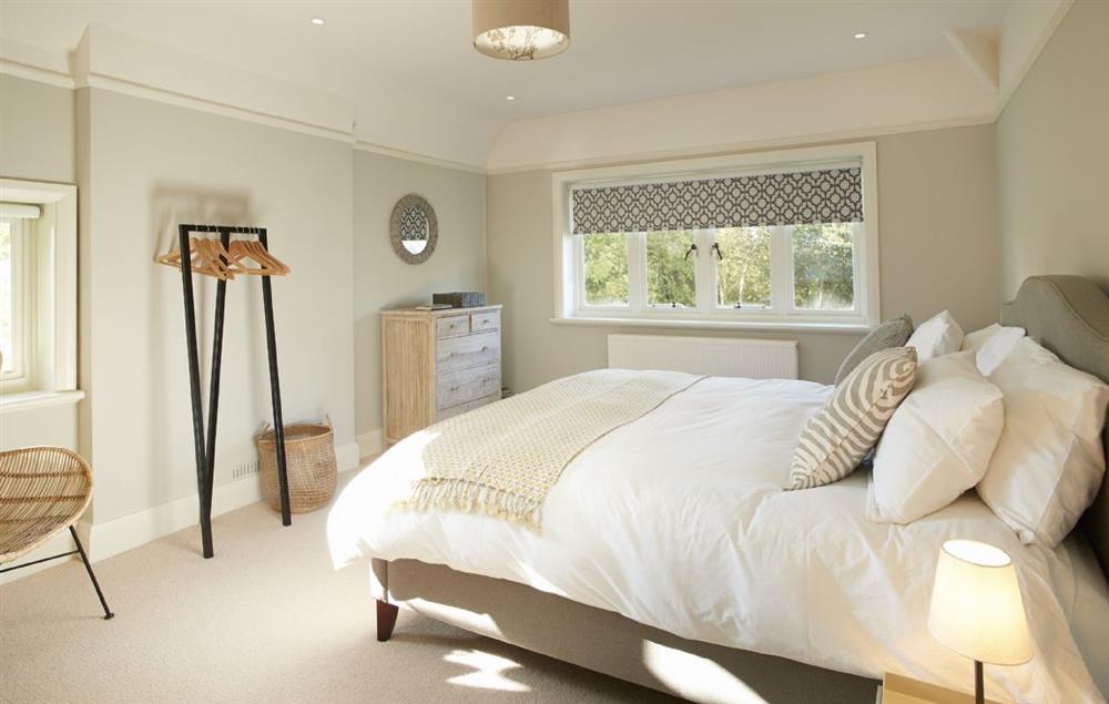 Master bedroom with 6’ super king size bed and en suite bathroom at Green Gables, Eardisley