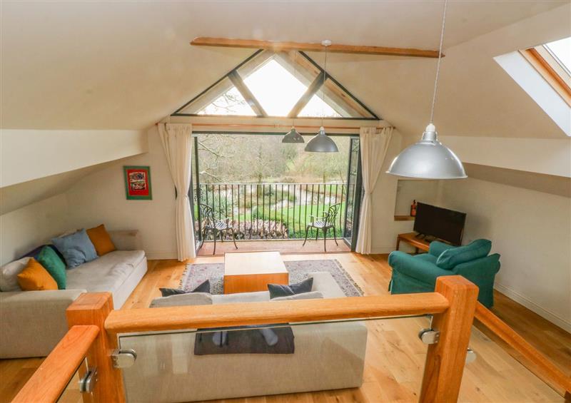 Relax in the living area at Green Grove Barn, Peniel near Carmarthen