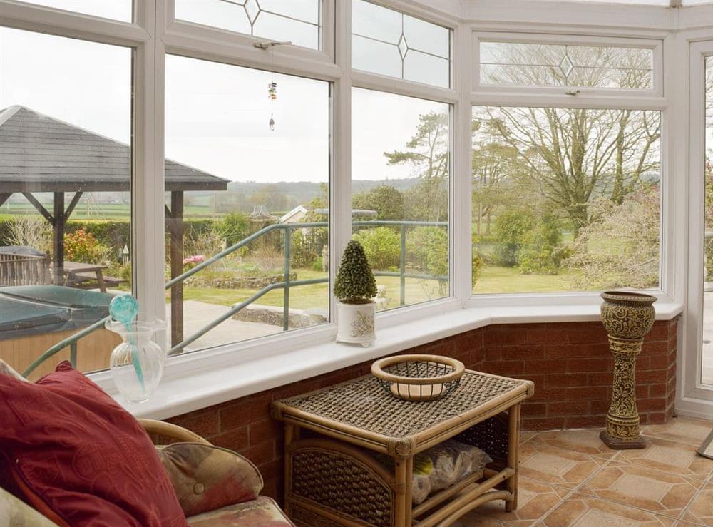 View over garden from sunroom at Green Haven in Narberth, Pembrokeshire, Dyfed