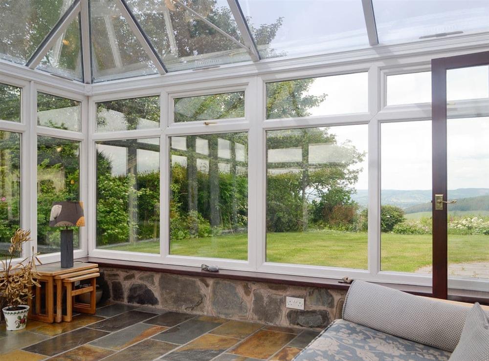 Light and airy conservatory at Green Lane Cottage in Aberhafesp, near Newtown, Powys