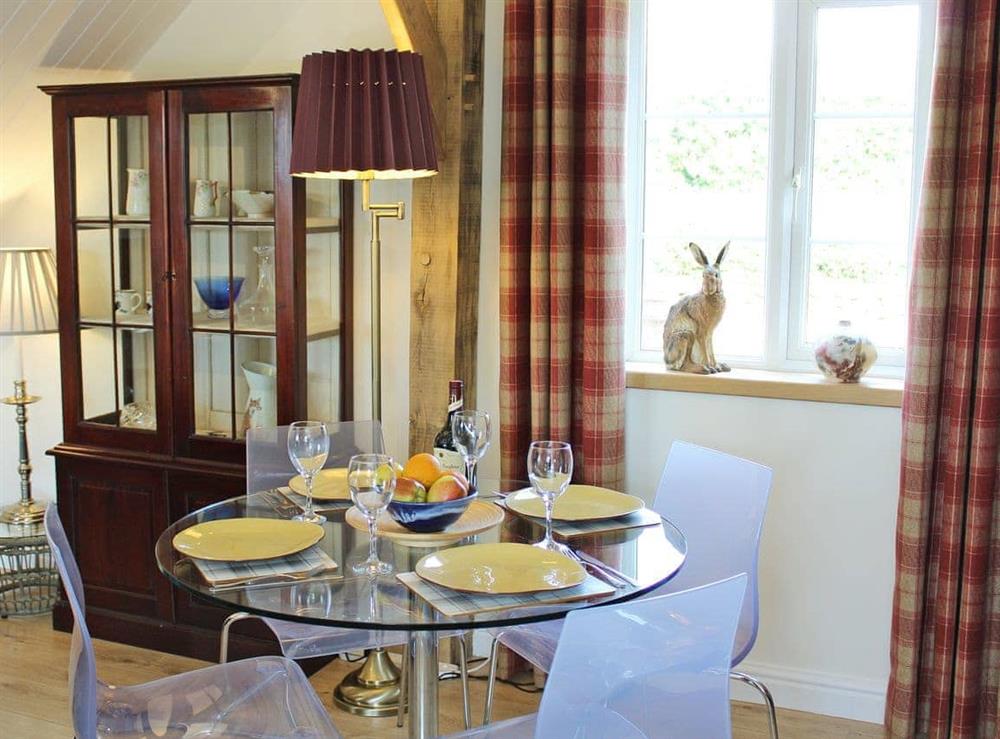 Attractive dining area at Green Oak Cottage in Sandley, near Gillingham, Dorset