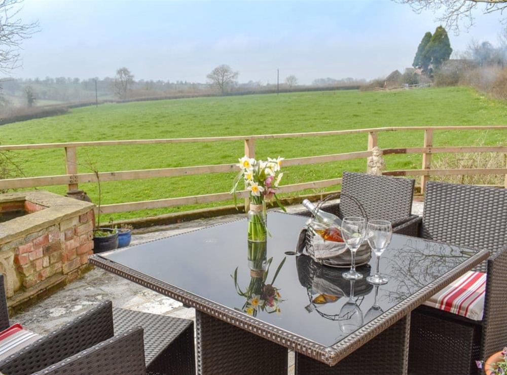 Sitting-out-area with wonderful countryside views at Green Oak Cottage in Sandley, near Gillingham, Dorset