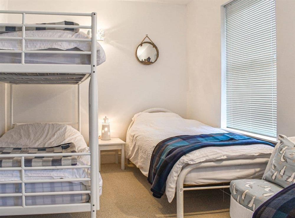 Bunk beds and two single beds at Greenacres in Treburrick near Porthcothan Bay, Cornwall