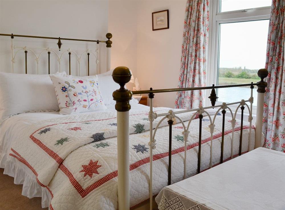 Comfortable double bedroom with riverside views at Greenbank Cottage in Downham Market, Norfolk