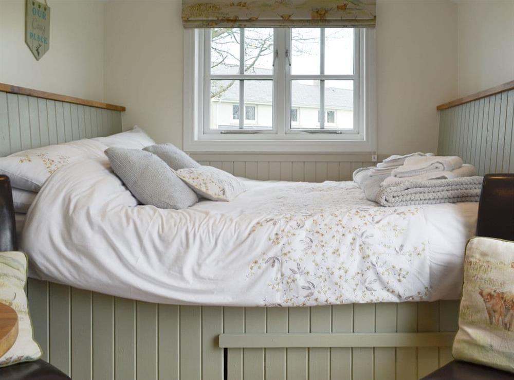 Charming bed area at Greengill Farm Shepherds Hut, 
