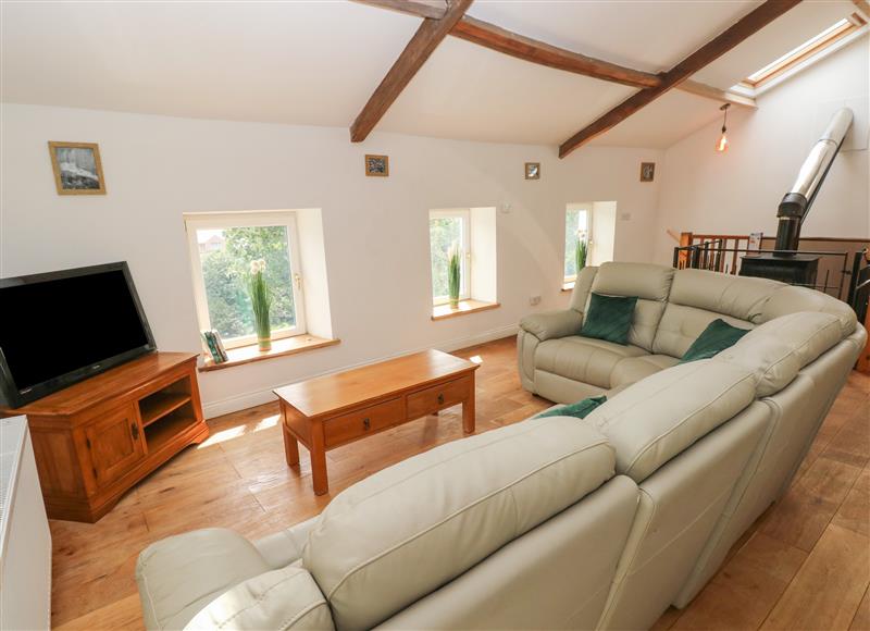 Relax in the living area at Greenheart Cottage, Pontrhydyfen
