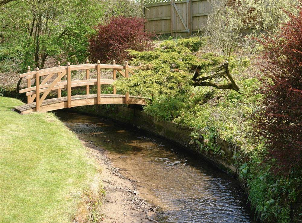 Attractive stream runs through the bottom of the garden at Greenlands Farmhouse in Barmby Moor, York., North Yorkshire