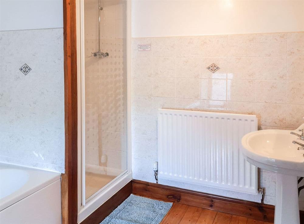 Bathroom with separate shower cubicle at Greenrigg Cottage in Wigton, Cumbria