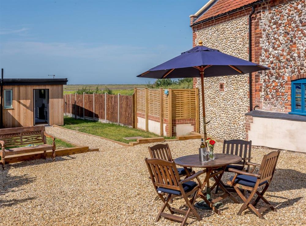 Lovely patio area with a range of seating options at Greenrush in Blakeney, near Holt, Norfolk