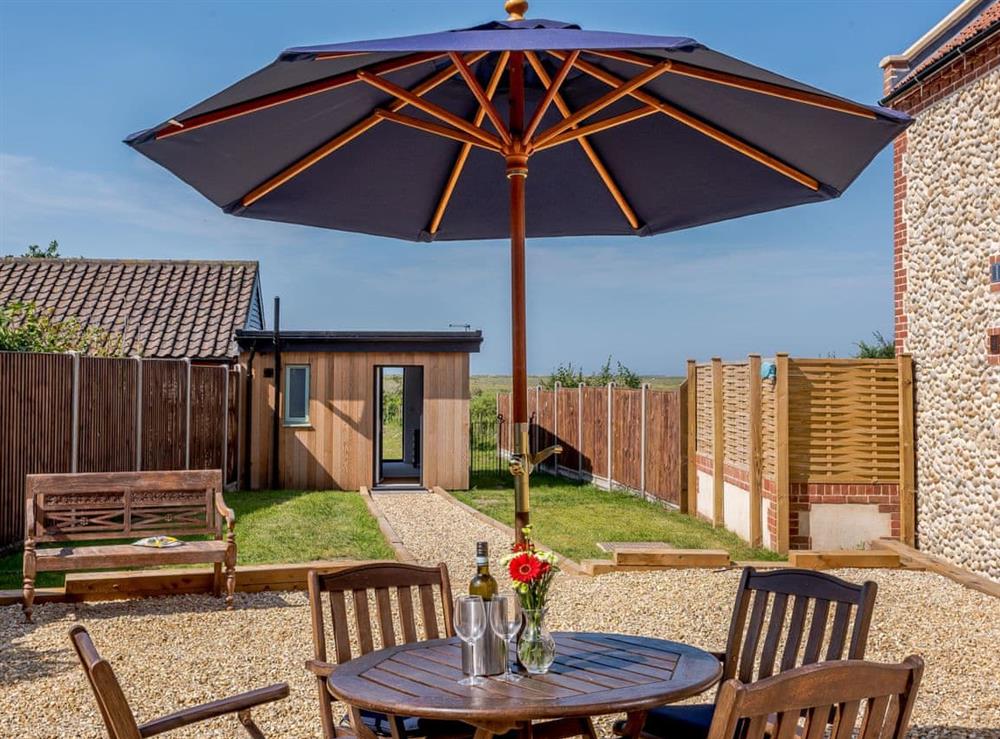 Outdoor furniture within the patio area at Greenrush in Blakeney, near Holt, Norfolk