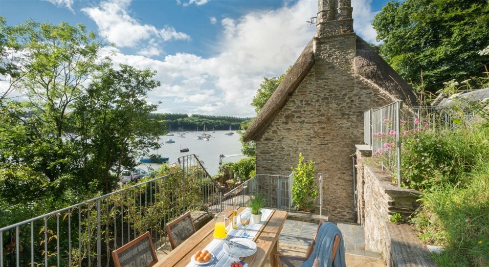 The idyllic outside dining area (photo 2) at Greenway Ferry Cottage in Nr Brixham, Devon