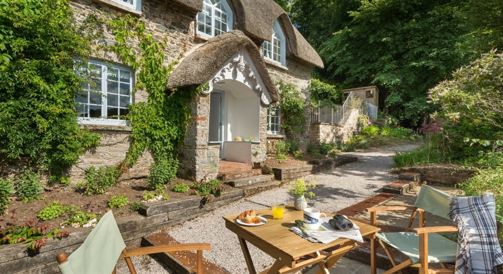 The patio and seating area (photo 2) at Greenway Ferry Cottage in Nr Brixham, Devon
