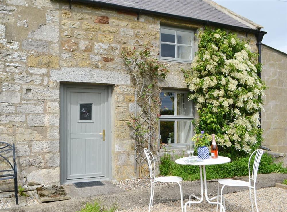 Patio area with outdoor furniture at Greenyard Cottage in Longhorsley, near Morpeth, Northumberland