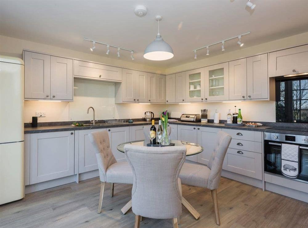 Fully appointed kitchen with dining area at Apartment 1, 