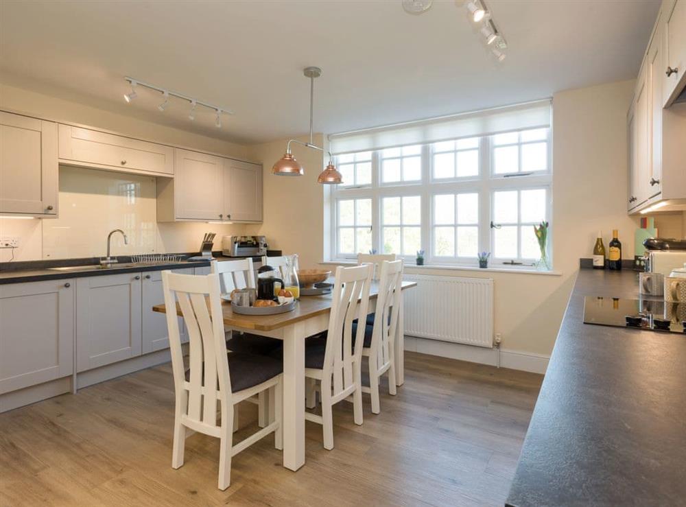Fully appointed fitted kitchen with dining area at Apartment 2, 
