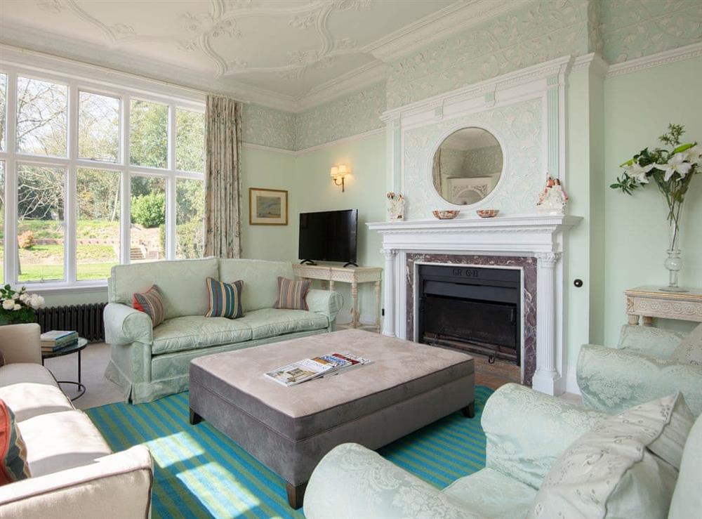 Elegant living room with open fire at Gresham Hall, 