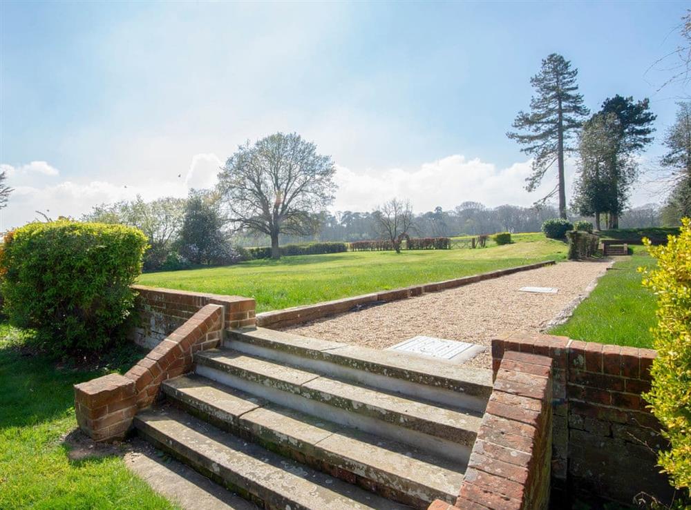 Lawned garden with sitting-out area at Gresham Hall, 