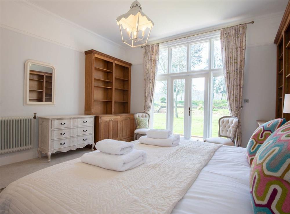 Spacious bedroom with super kingsize bed (photo 2) at Gresham Hall, 