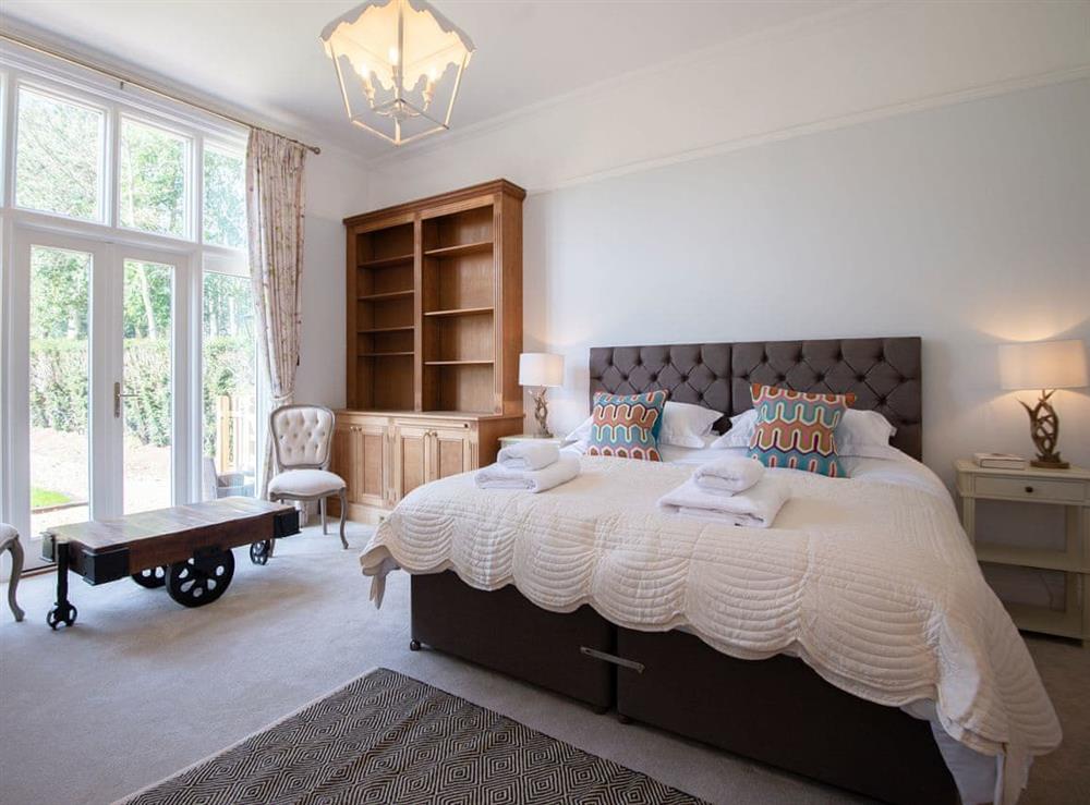 Spacious bedroom with super kingsize bed at Gresham Hall, 