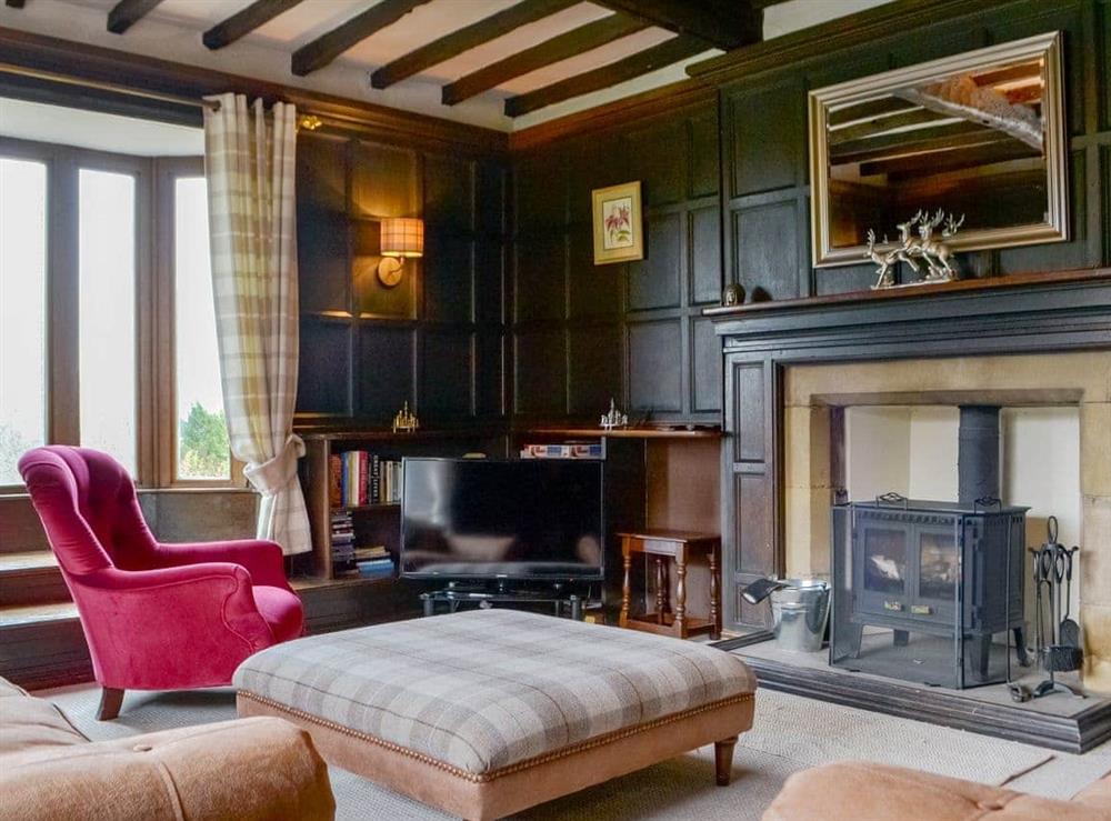 Characterful living room with wood burner at Grey Walls in Penrith, Cumbria