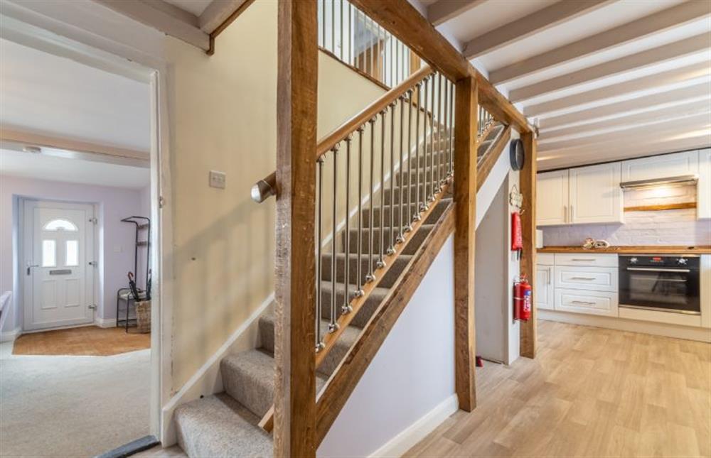Ground floor: Stairs from the kitchen lead to first floor at Greyhound Cottage, Sculthorpe near Fakenham