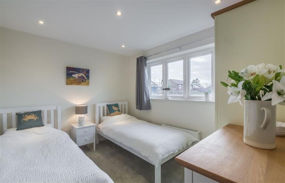 First floor: Bedroom four with twin beds at Greyseals, Brancaster near Kings Lynn