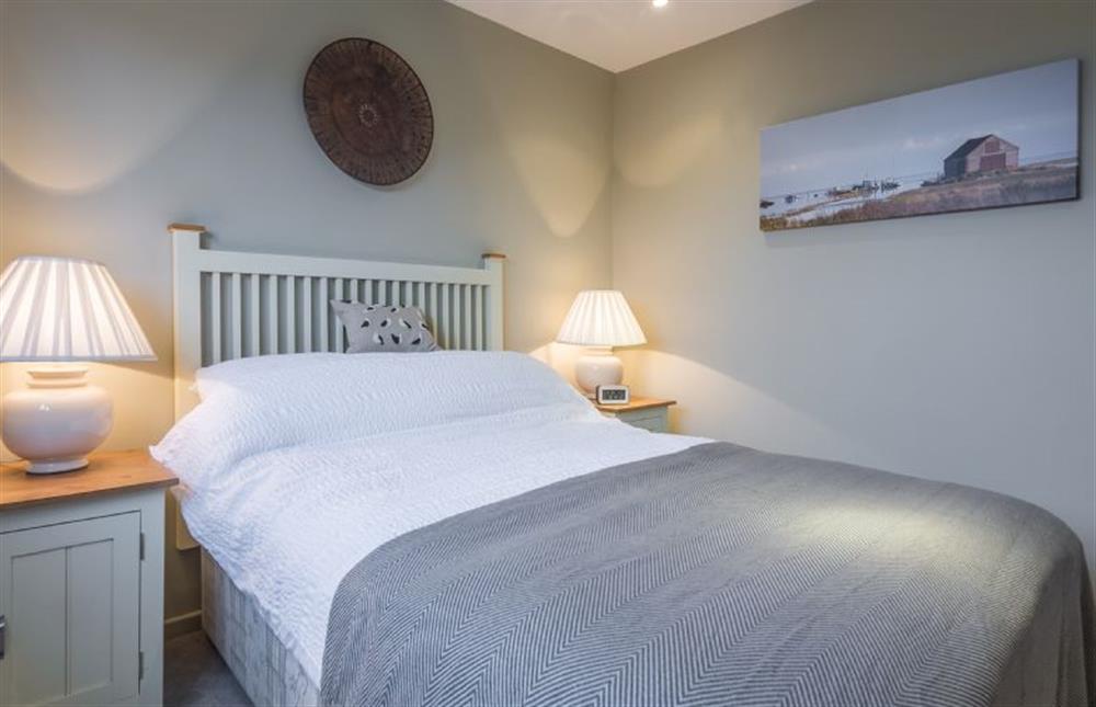 First floor: Bedroom two with king-size bed at Greyseals, Brancaster near Kings Lynn