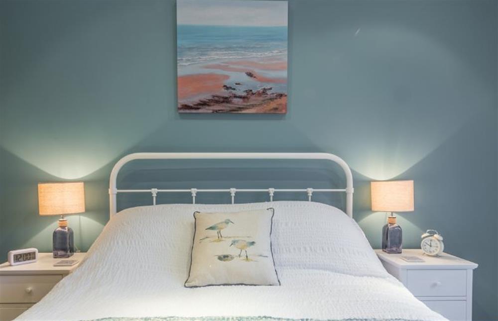 Ground floor: Master bedroom with King-size bed at Greyseals, Brancaster near Kings Lynn