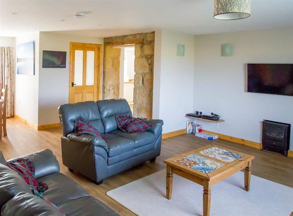 Welcoming living area at Grieves Cottage in Portmahomack, near Tain, Ross-Shire
