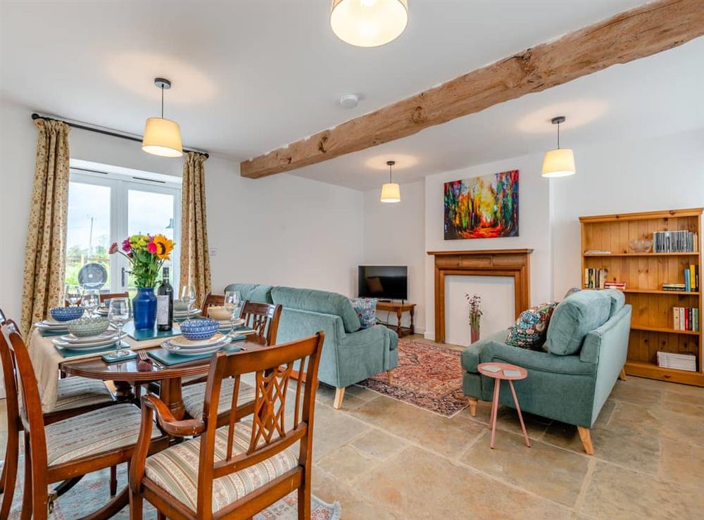 Living room/dining room at Grooms Cottage in Westbury-on-Severn, Gloucestershire