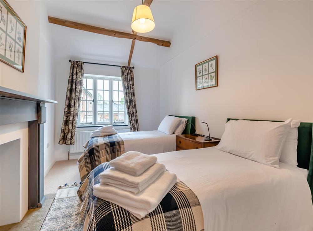 Twin bedroom at Grooms Cottage in Westbury-on-Severn, Gloucestershire