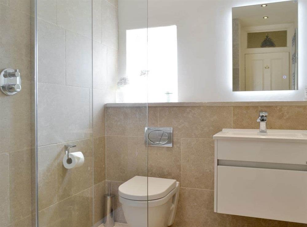 Modern shower room with walk-in shower at Grosvenor Cottage in Alnmouth, Northumberland