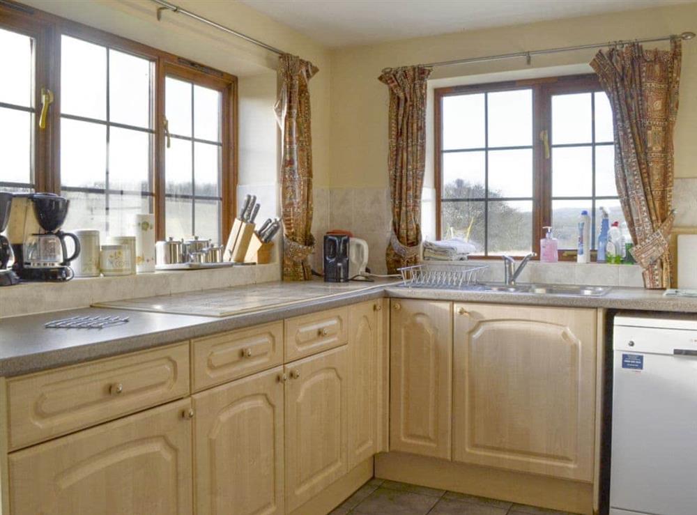 Well-equipped fitted kitchen at Grove Sprightly Barn in Craven Arms, Shropshire