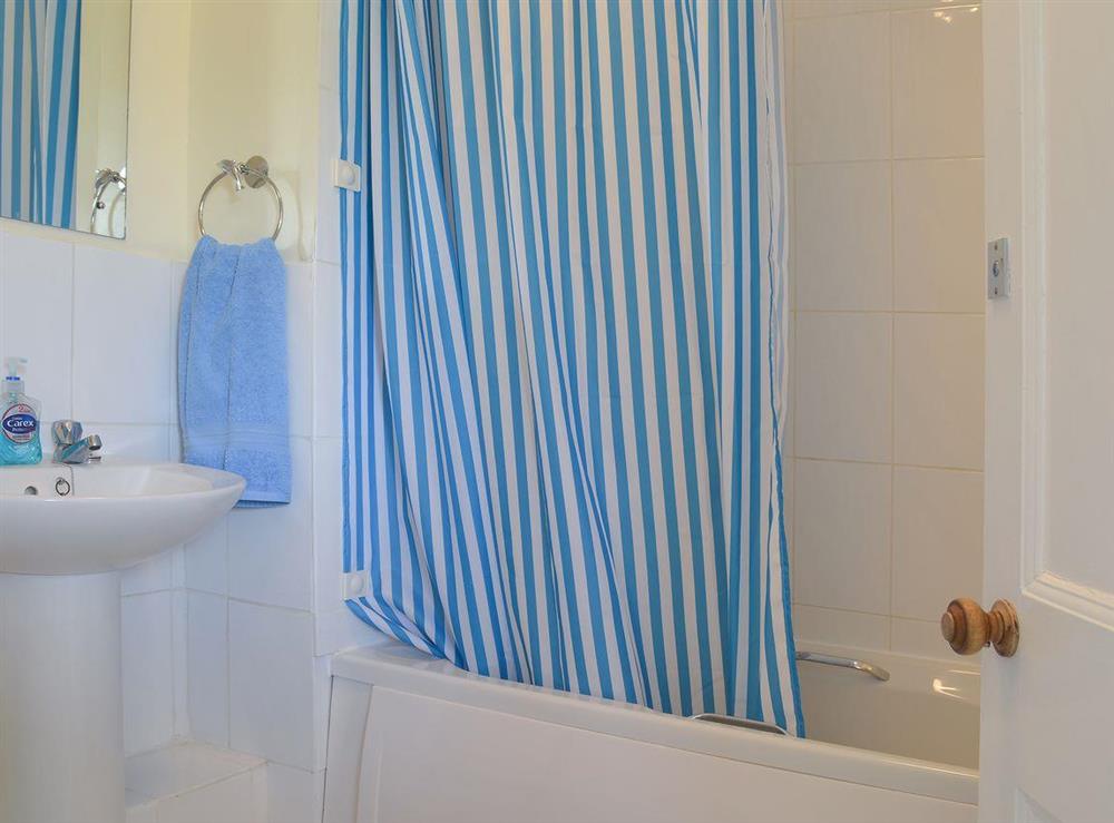 Bathroom with shower over the bath at Guinevere in Blue Anchor, near Minehead, Somerset